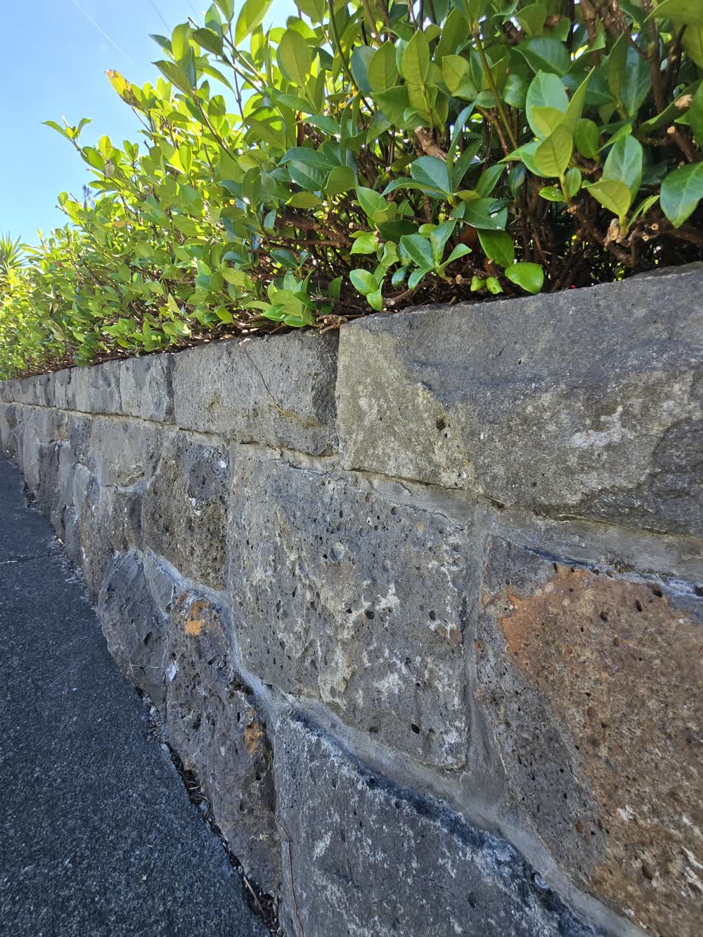 Rugged stone retaining wall with flat top